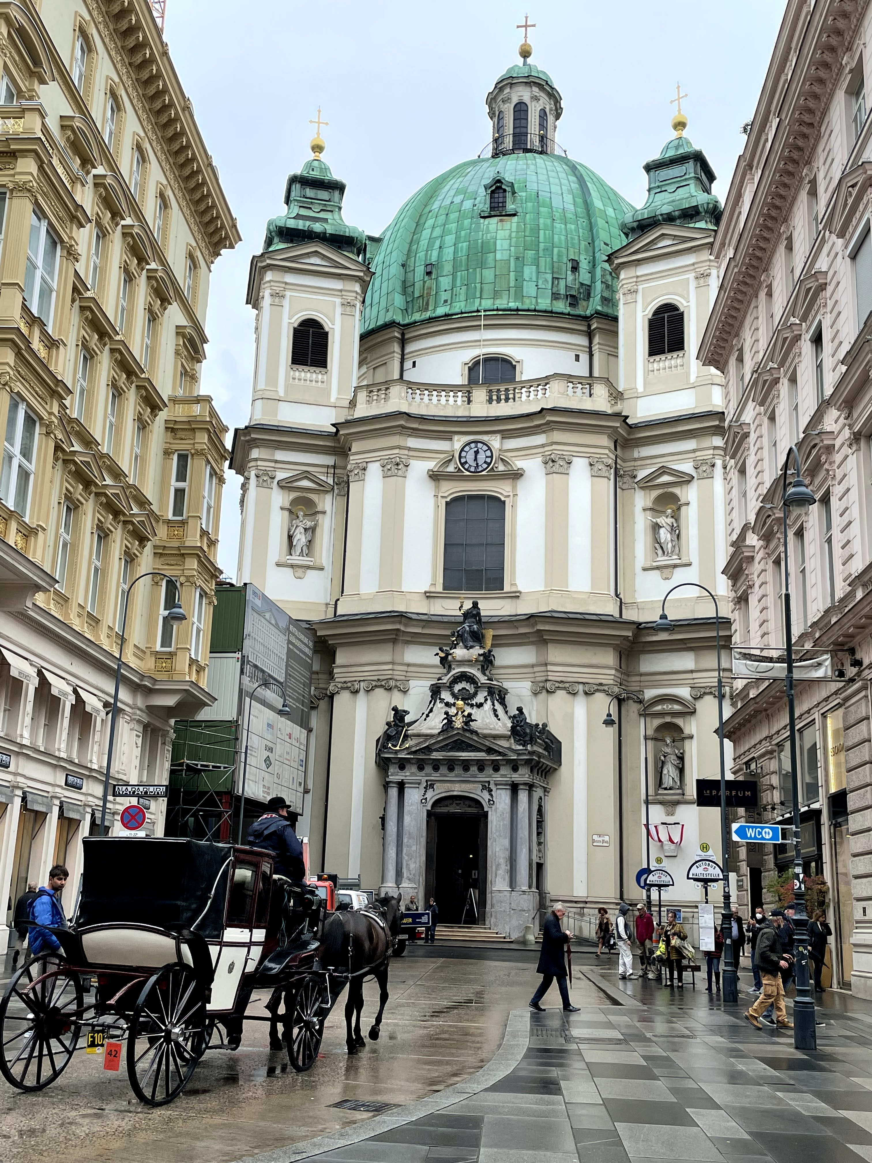 View of Peterskirche Church with horse carriage